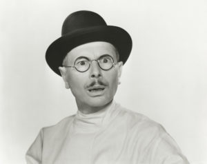 Person with glasses making a face